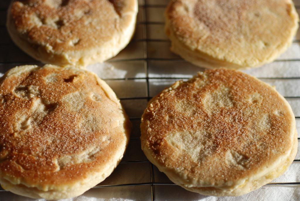  freshly baked banfora. Little puffed pancake like desserts sprinkled with cinnamon and sugar.
