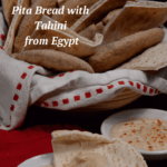 A basket of Egyptian pita bread served with tahini.