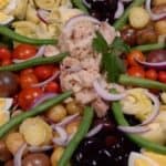 A display of the ingredients of an authentic nicoise salad