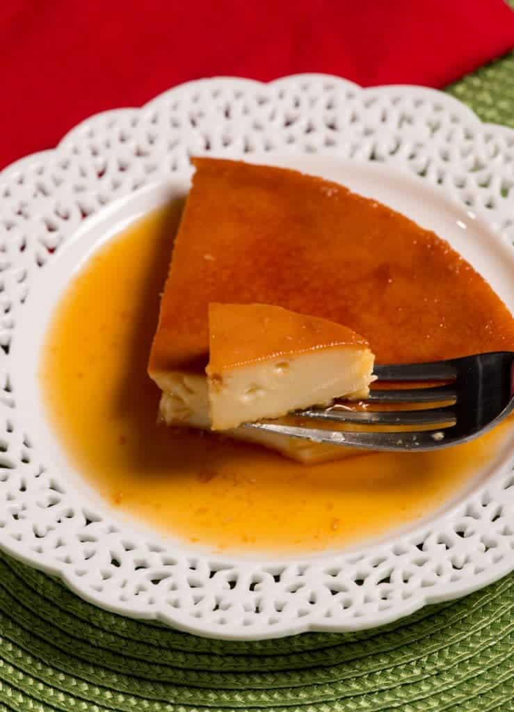 A slice of Mexican flan dripping in caramel sauce 