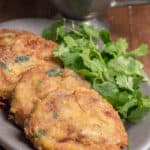 a plate of shami kababs with coriander