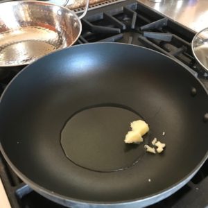 wok with ghee and oil