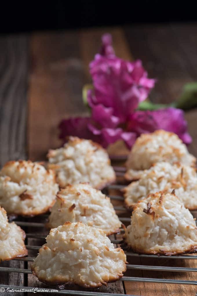 Panamanian Cocadas on a cooling rack with a purple orchid in the background