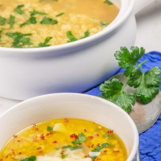 A tureen and bowl of Italian egg drop soup