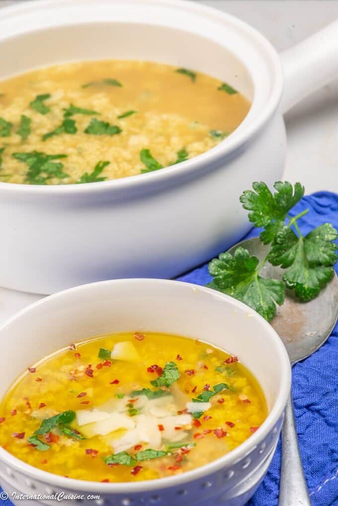 A tureen and bowl of Italian egg drop soup