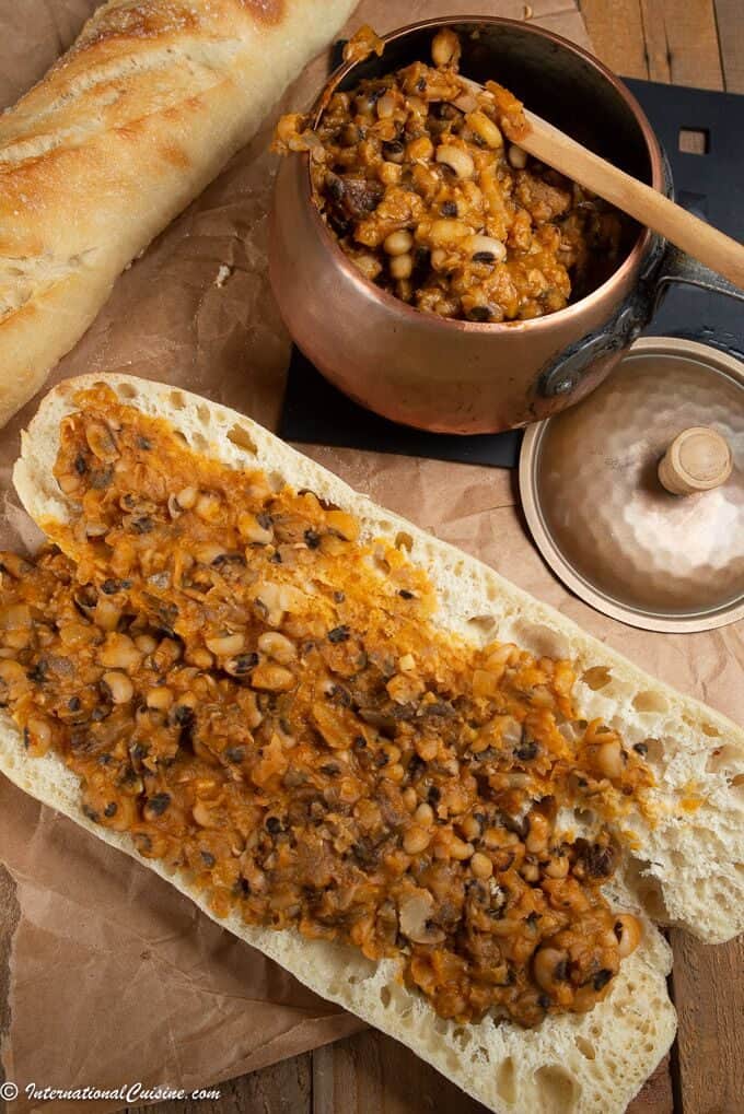 A french baguette smothed with a spicy bean dish called ndmabe in Senegal