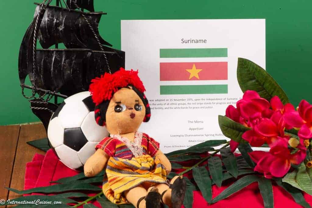 Symbols of Suriname a picture of the falg, a ship, a soccor ball and theit national flower