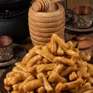 a plateful of Chak-chak fried dough pieces smothered in a honey syrup