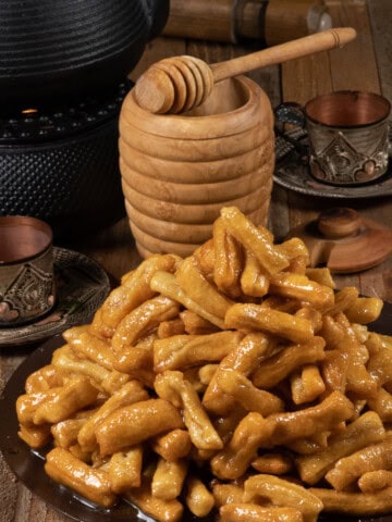 a plateful of Chak-chak fried dough pieces smothered in a honey syrup