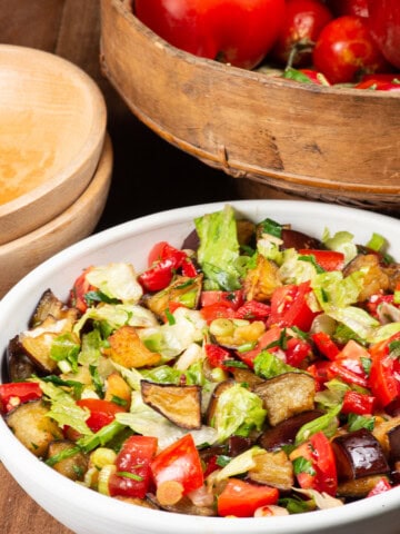 A colorful bowl of Turkmenistan Fried Eggplant Salad