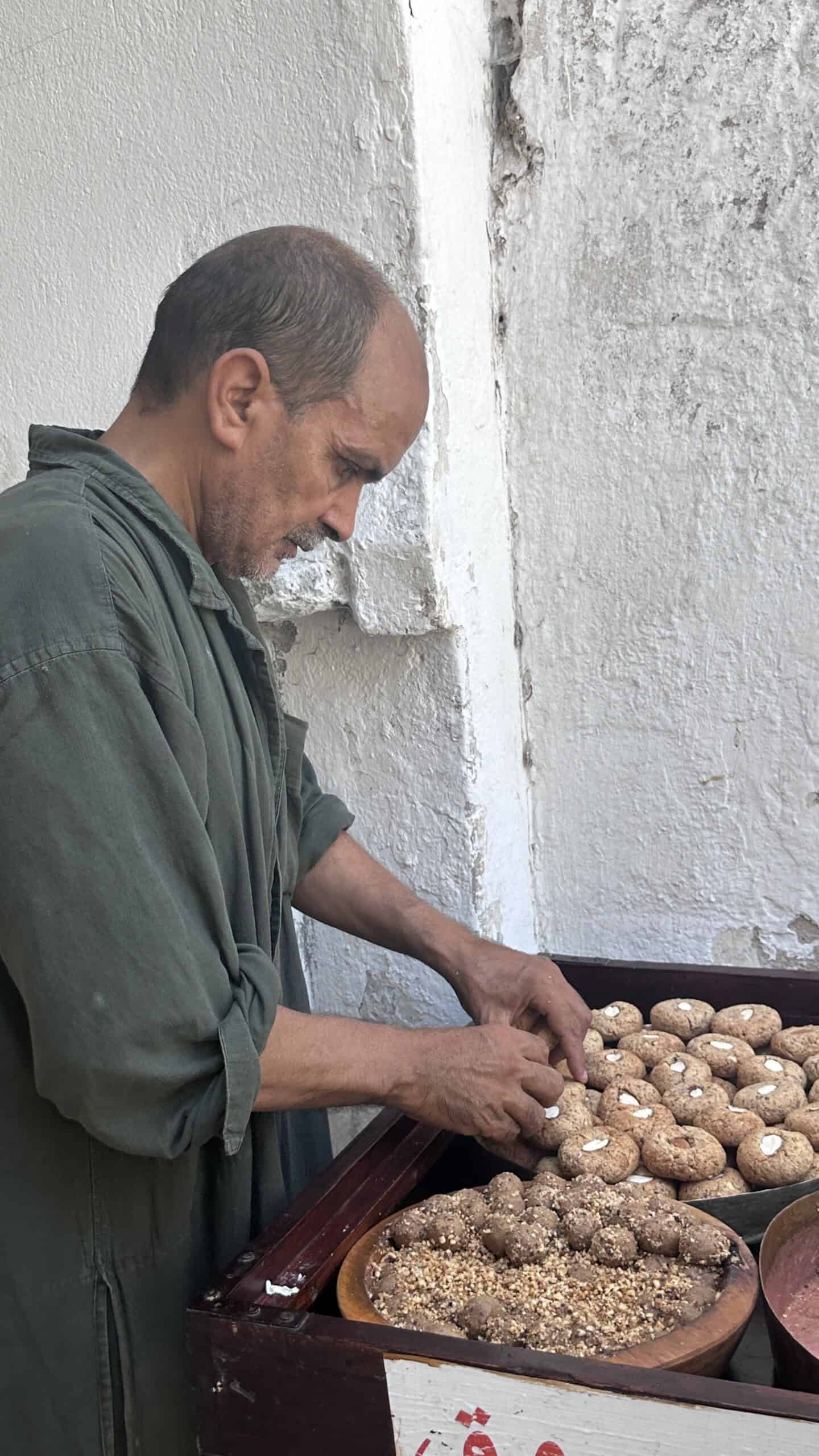 vendor preparing traditional sweets in the Medina of Tunis, Tunisia